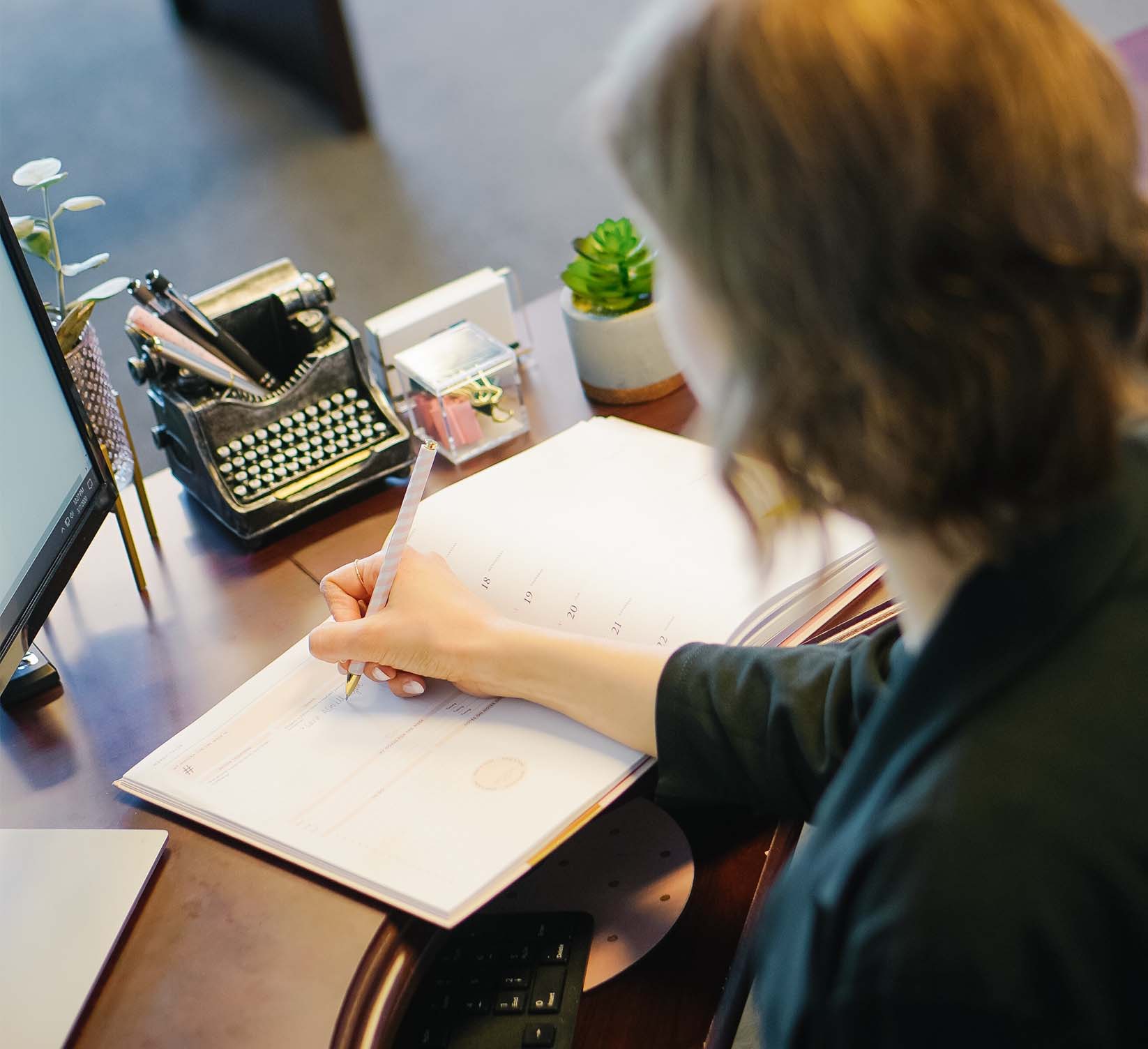 woman writing in a notebook